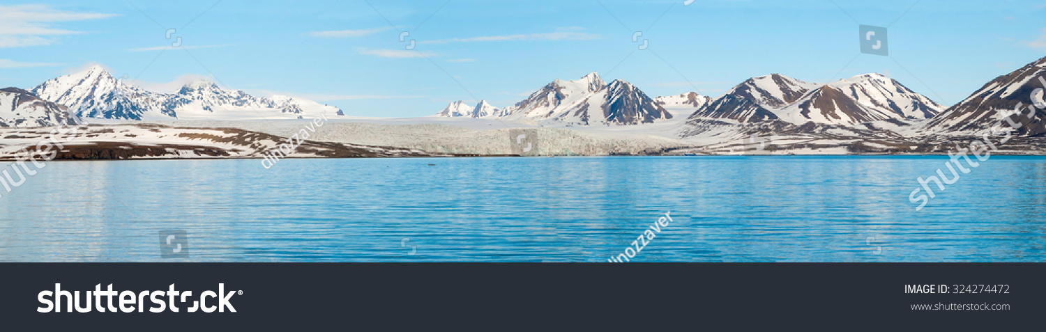 Panorama of glacier above the sea with the mountains behind, Svalbard, Norway #324274472