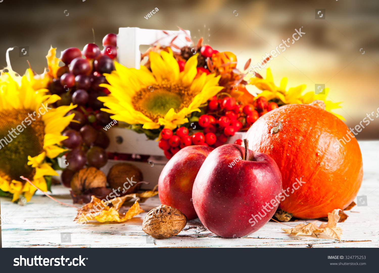 Autumn nature concept. Fall fruit and vegetables on wooden table #324775253