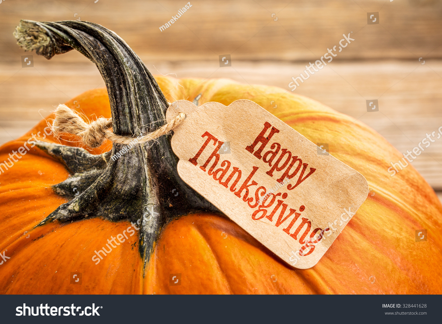 pumpkin with a Happy Thanksgiving paper price tag -  holiday shopping concept #328441628