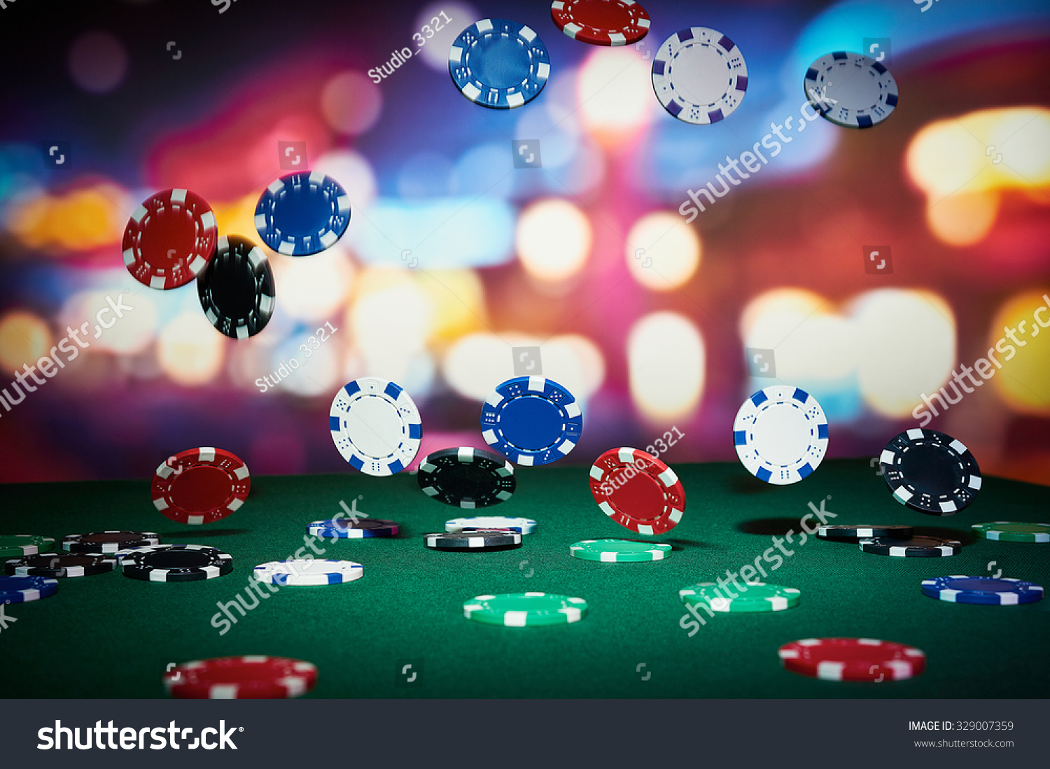 Poker chips on table in casino #329007359