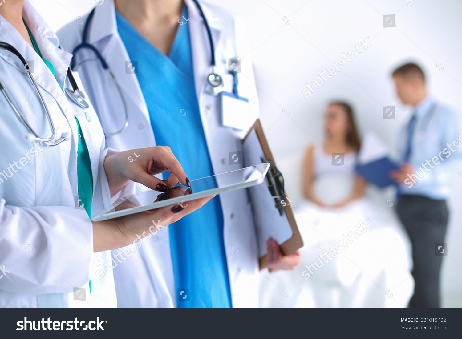 Young woman  doctor holding a tablet pc #331019402