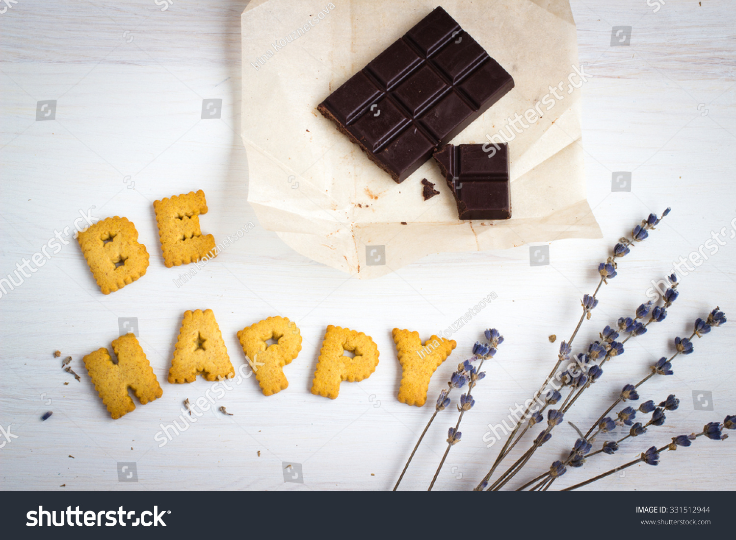 Quote BE HAPPY. Still life image with biscuits, organic chocolate and vintage cup of green tea white wooden background. Top view collage made of biscuits. Retro toned and instagram filtered image. #331512944