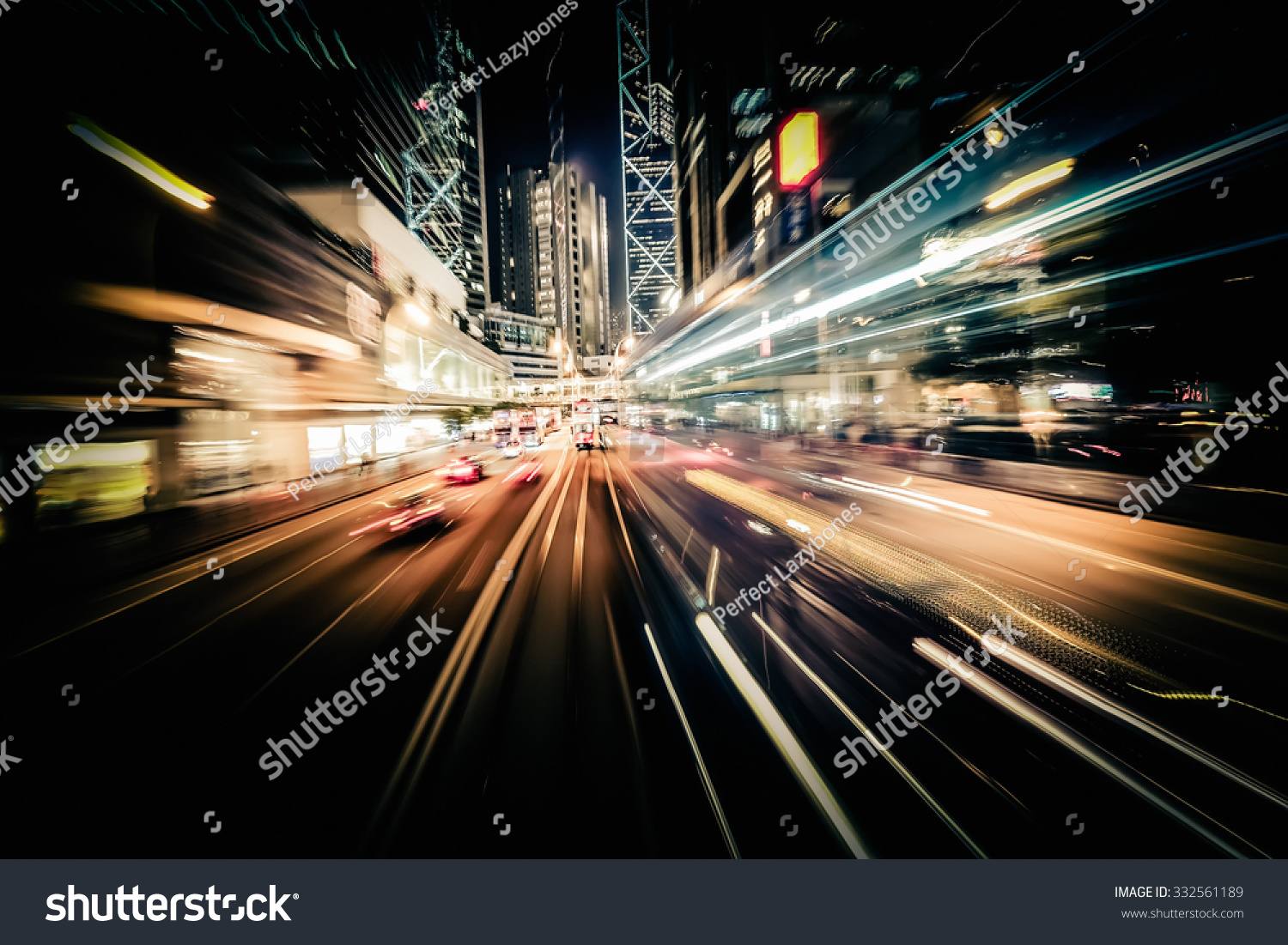 Abstract cityscape traffic background with motion blur, art toning. Moving through modern city street with  illuminated skyscrapers. Hong Kong #332561189