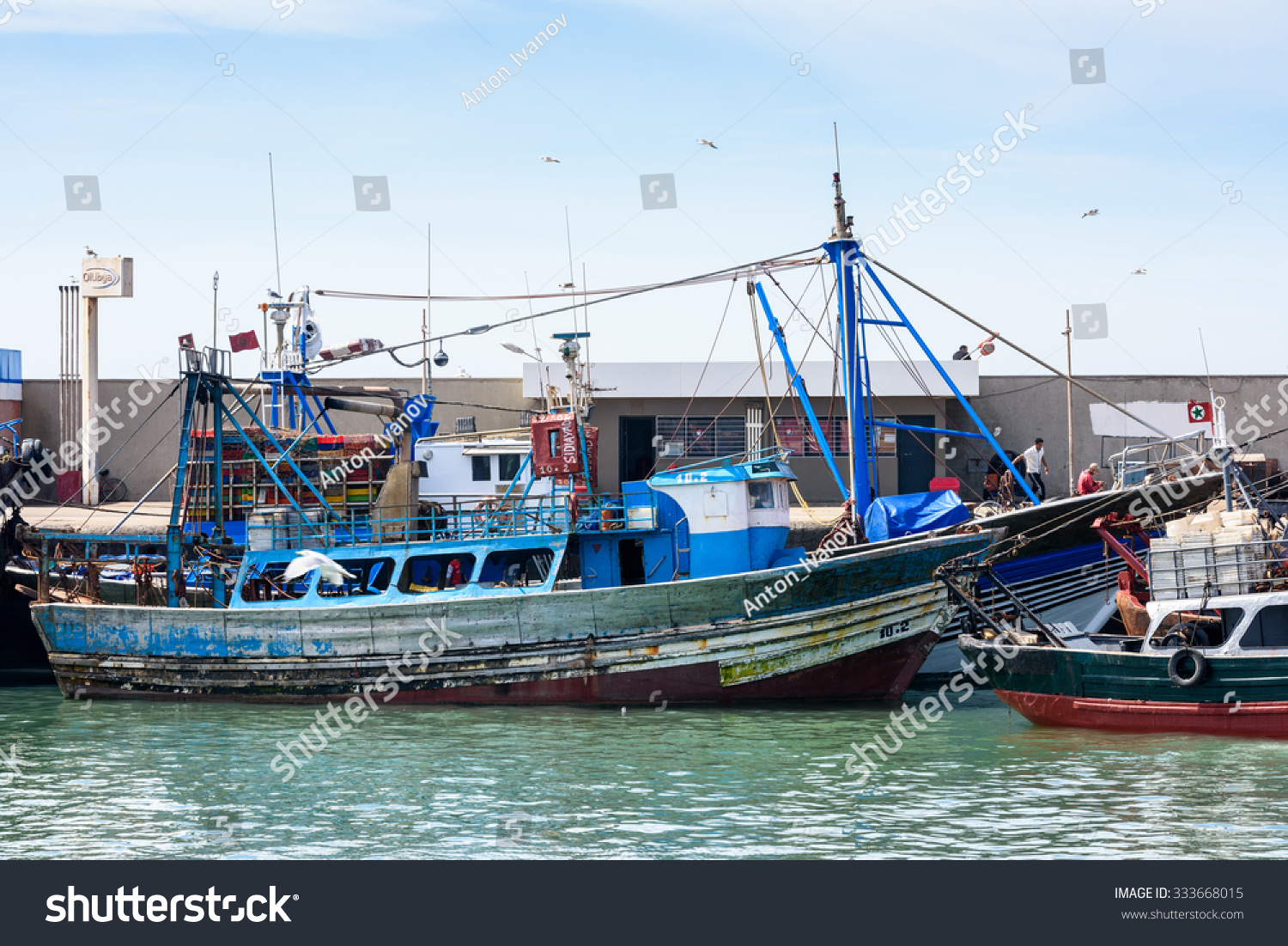 ESSOUIRA, MOROCCO - OCT 2, 2015: Fishing boat in the port on the coast of Essouira, Morocco. The city was called Sidi Megdoulin in 11th-century #333668015