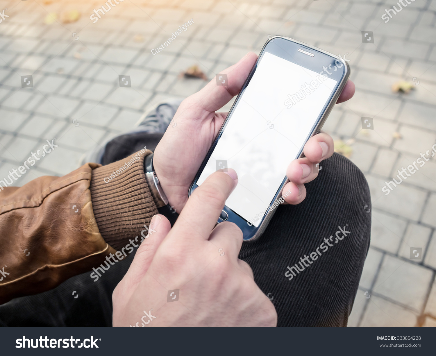 Mockup of mobile smartphone in man's hands #333854228