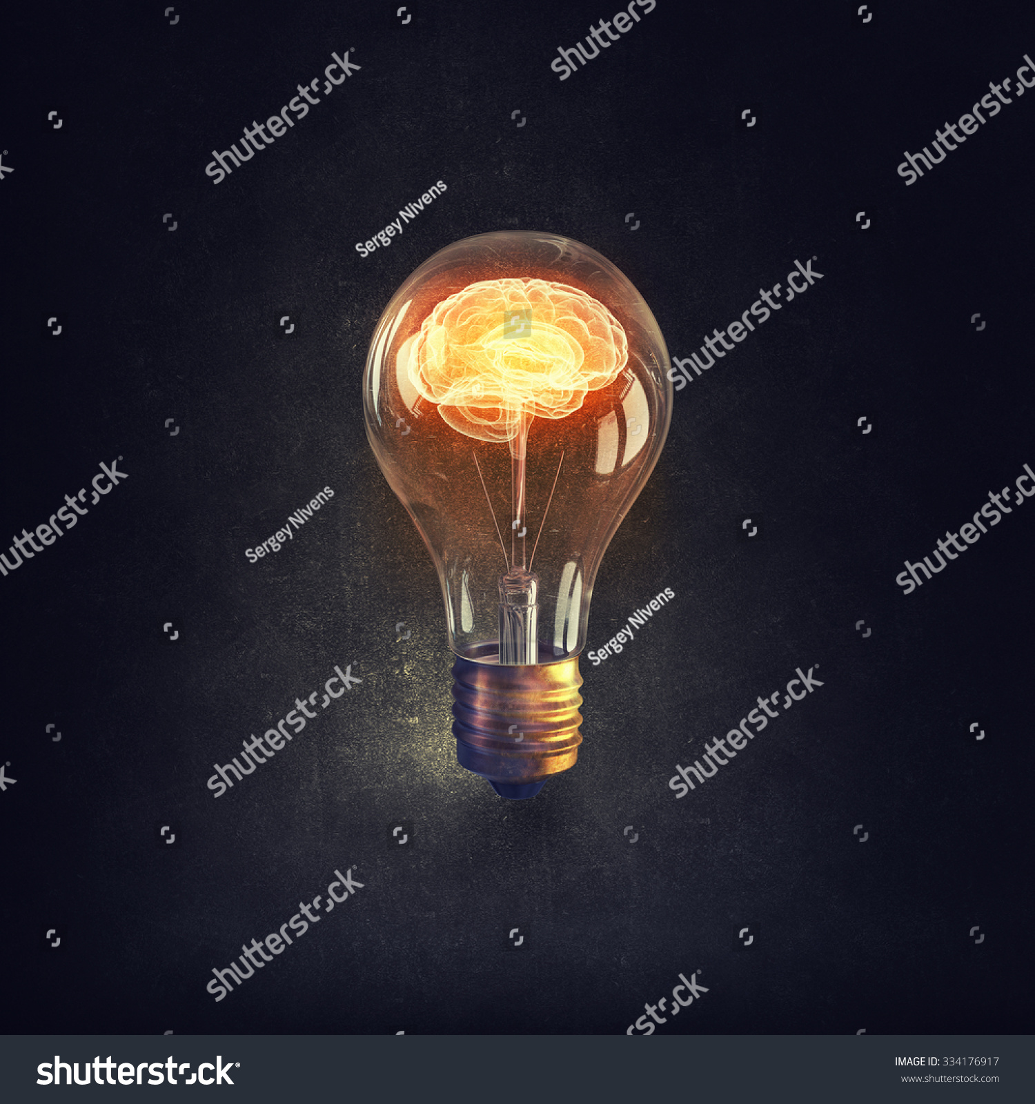 Human brain glowing inside of light bulb on dark background #334176917