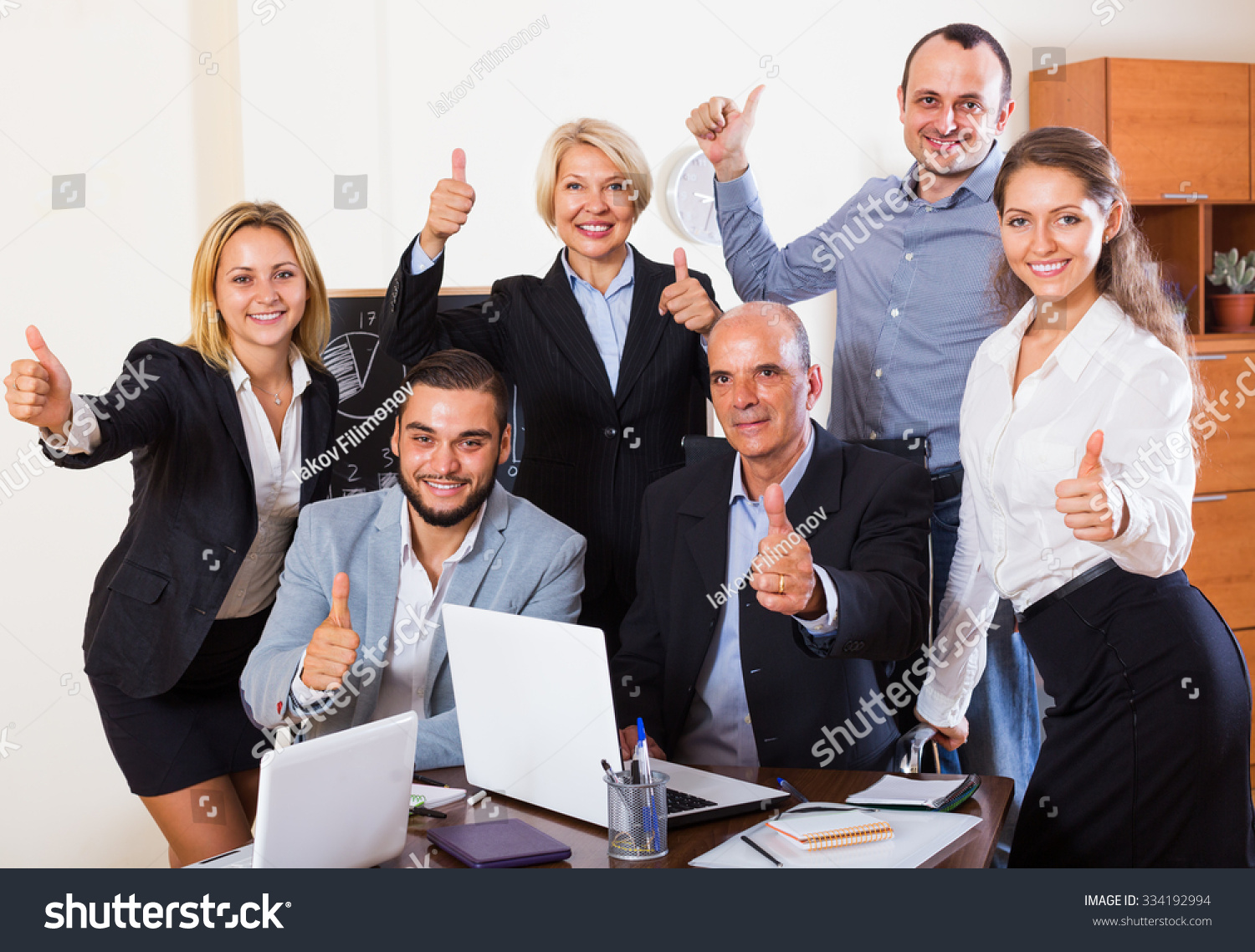 Successful happy business people having break together in office  #334192994