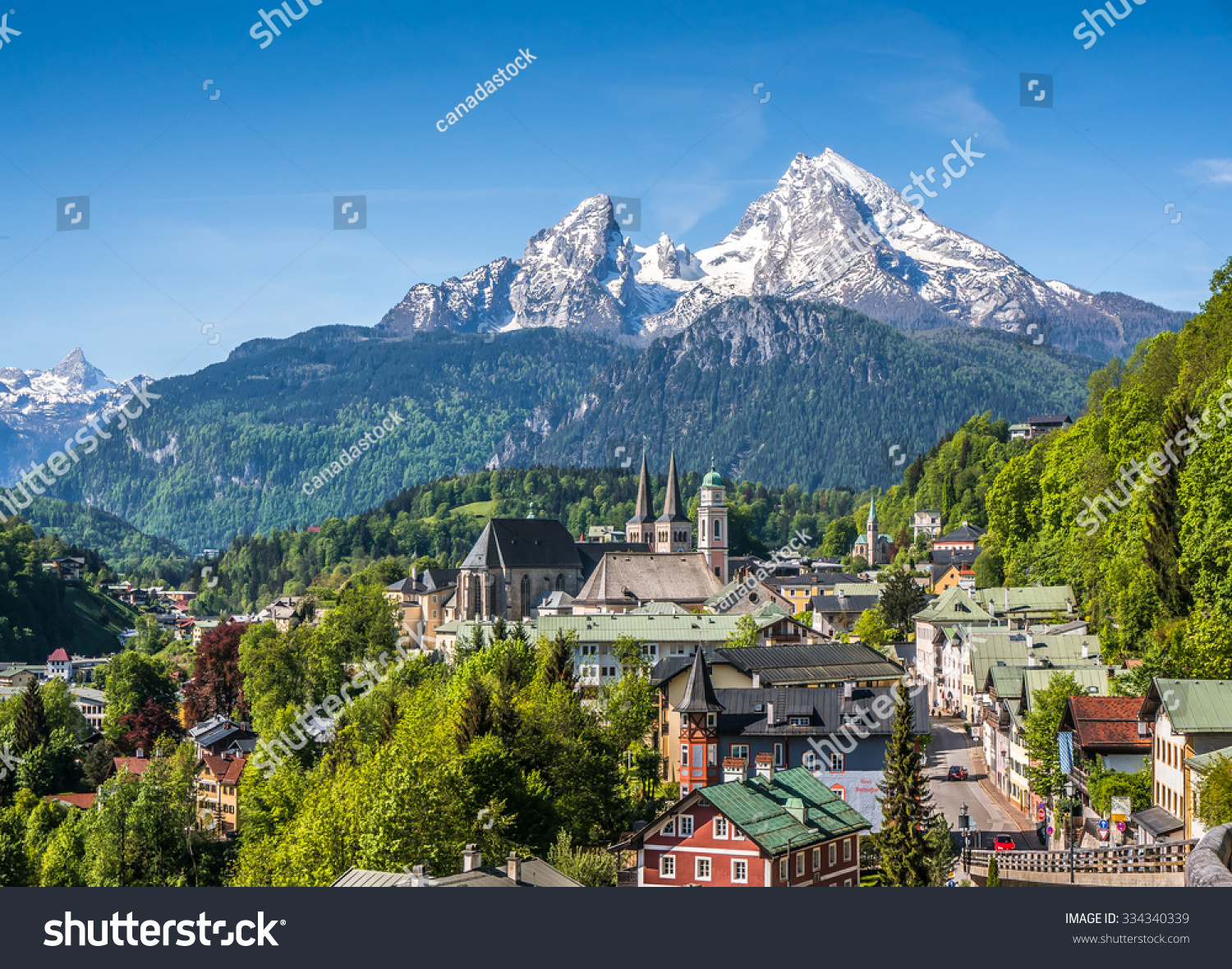 Historic town of Berchtesgaden with snowy Watzmann mountain in spring, Berchtesgadener Land, Upper Bavaria, Germany #334340339
