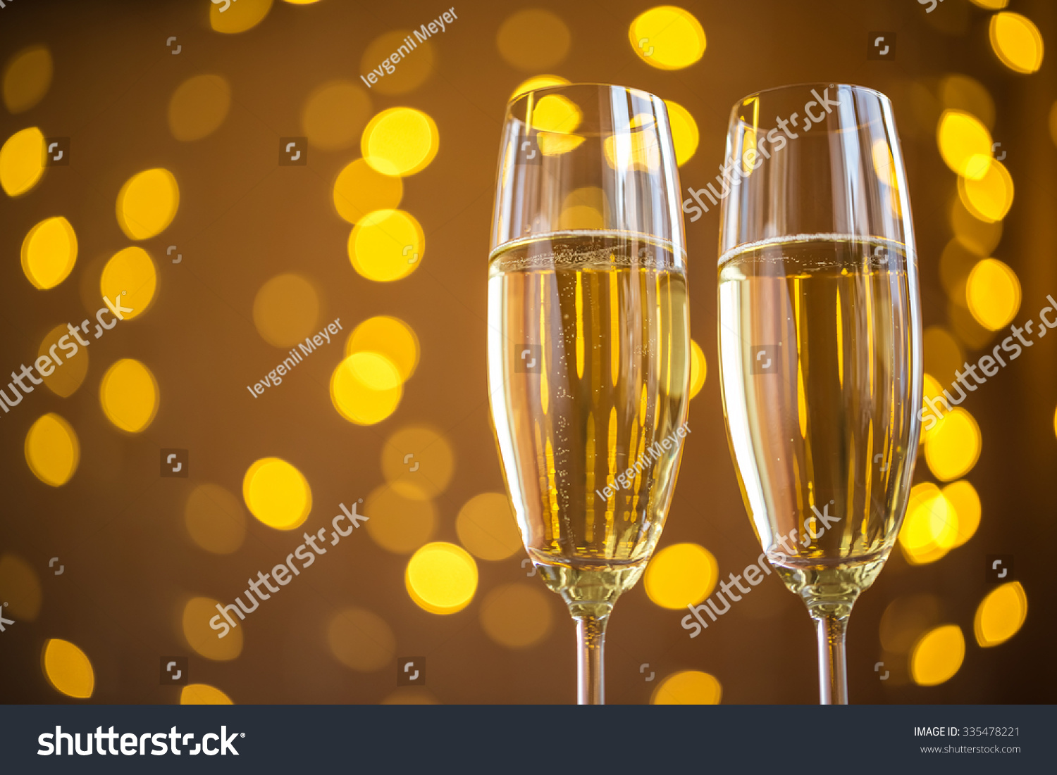 Two champagne glass on christmas bokeh background #335478221