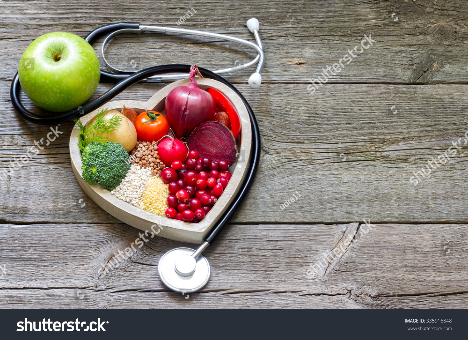 Healthy food in heart and cholesterol diet concept on vintage boards #335916848