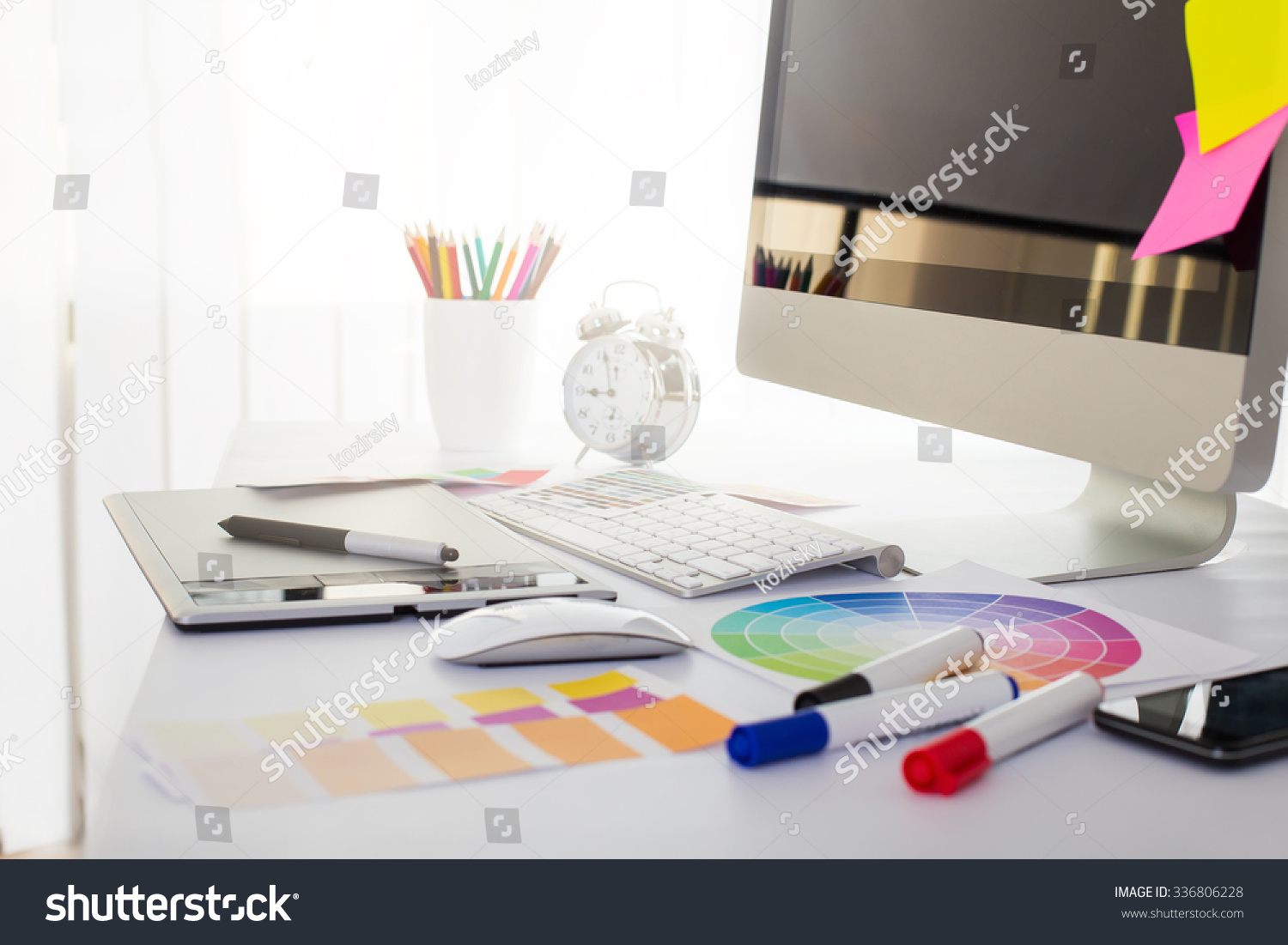 Modern office workplace with digital tablet, notepad, colorful pencils, glasses, in morning #336806228