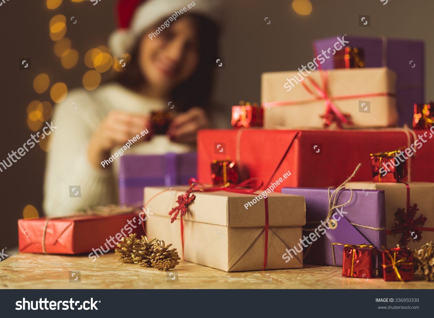 Image of smiling girl opening Christmas presents #336950330