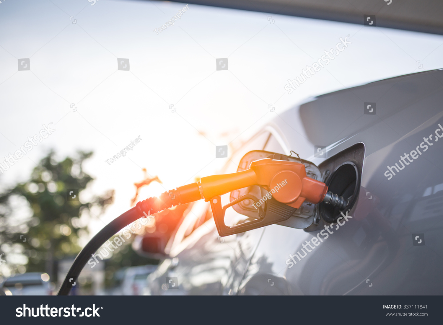 Car refueling on a petrol station. #337111841