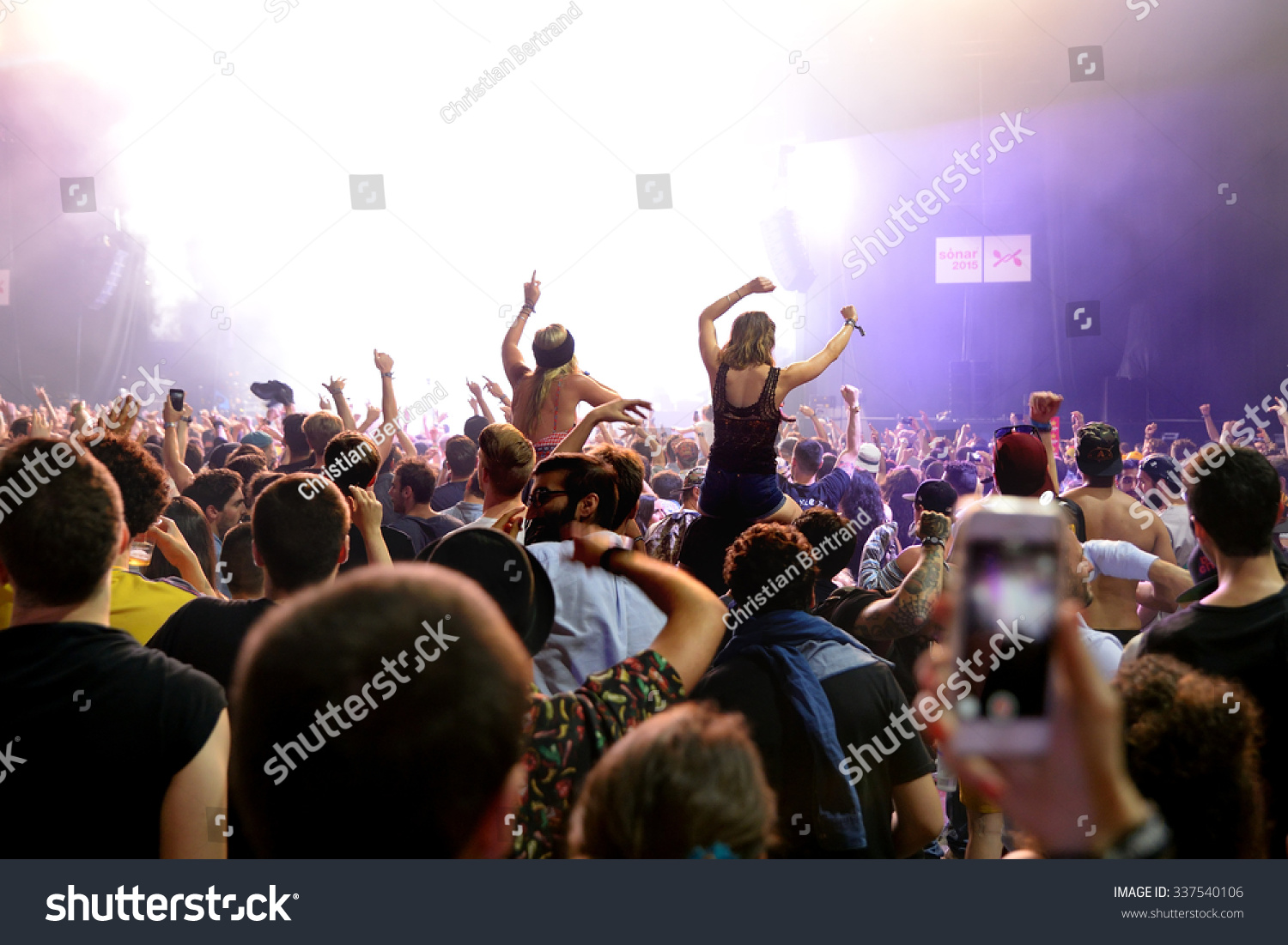BARCELONA - JUN 19: Crowd dance in a concert at Sonar Festival on June 19, 2015 in Barcelona, Spain. #337540106