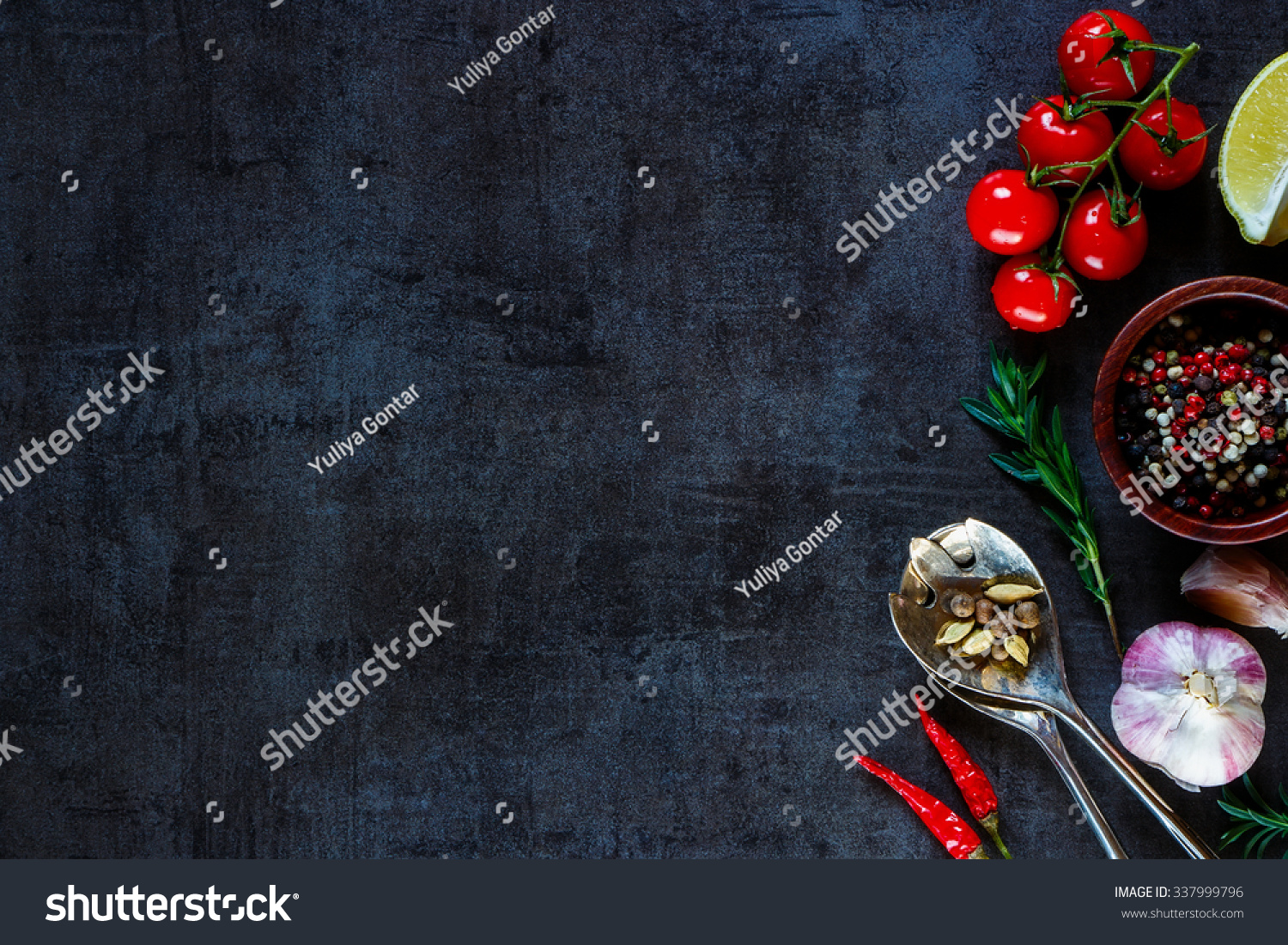 Vintage spoon and vegetables for cooking on dark metal background with space for text. Top view. Bio Healthy food ingredients.  #337999796