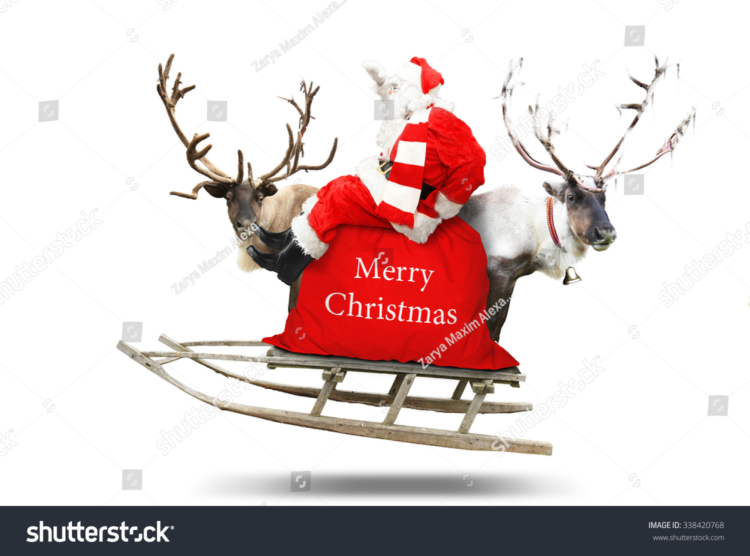 Santa Claus flies in a sleigh with reindeer #338420768