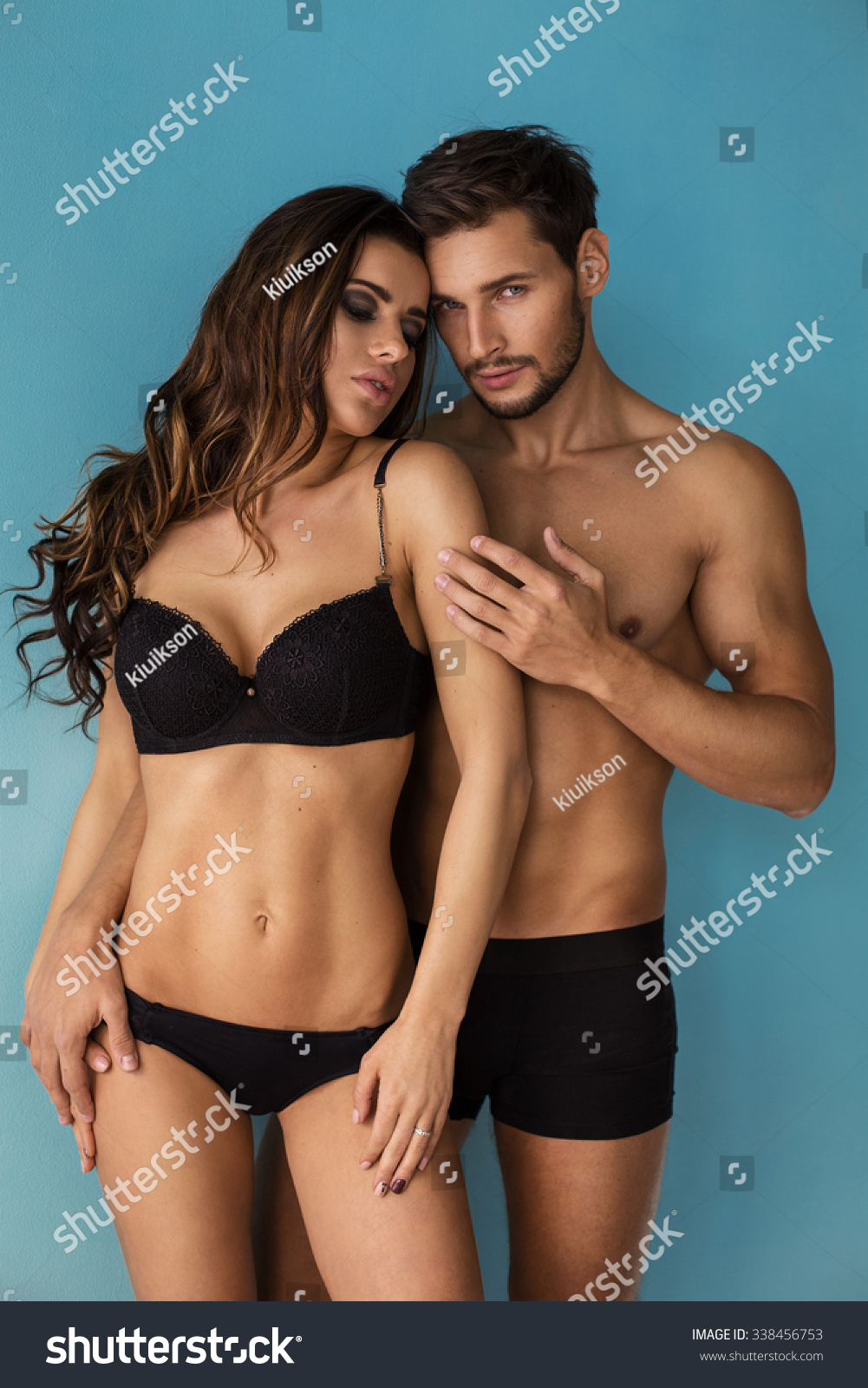 Fashion couple touching each other. Emotional portrait of unusual couple #338456753