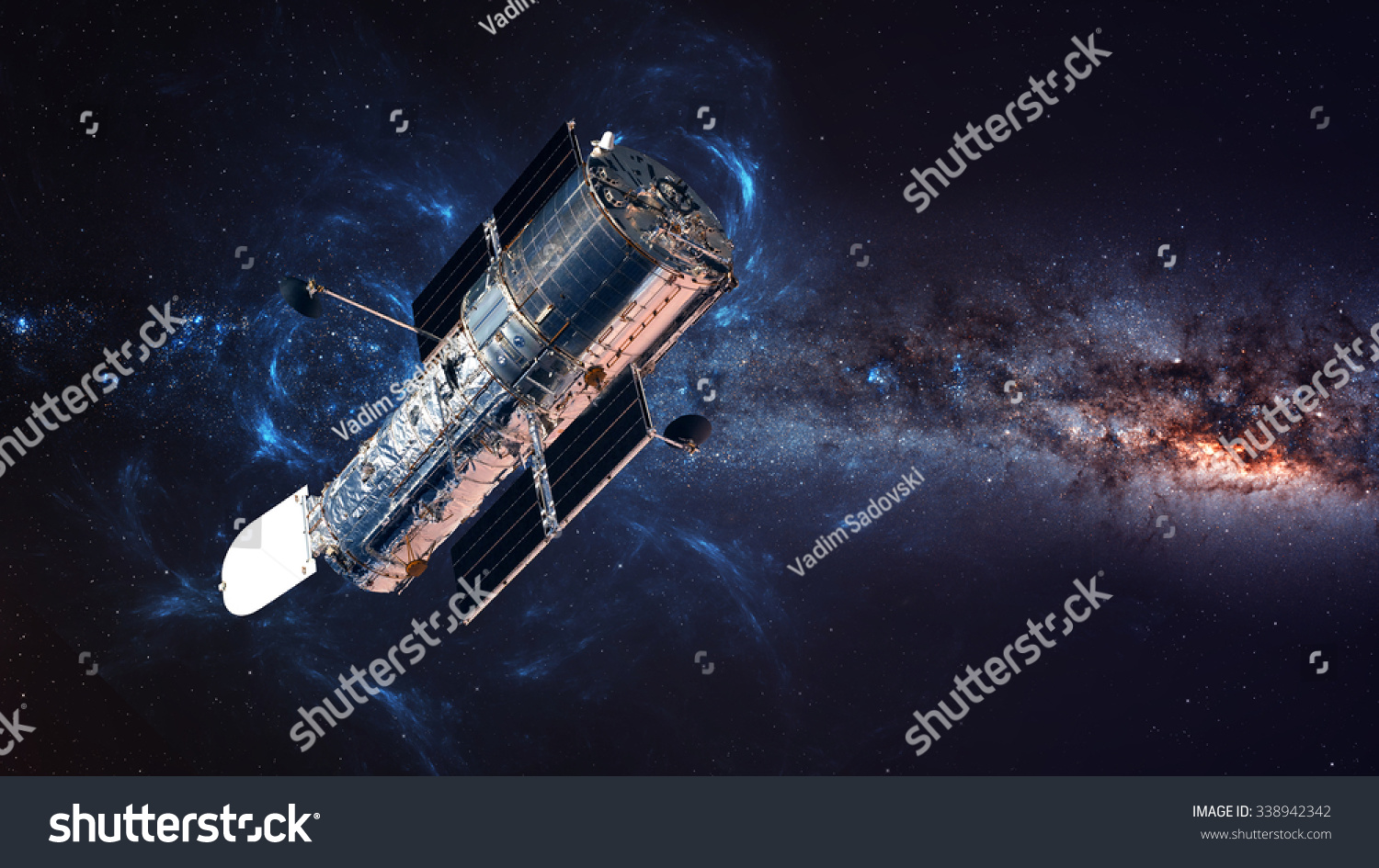 The Hubble Space Telescope in orbit above the Earth. Elements of this image furnished by NASA. #338942342
