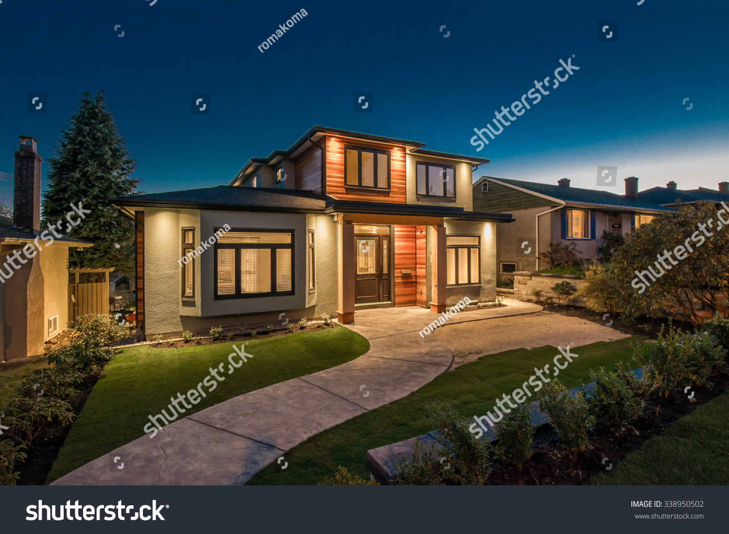Big luxury, modern house at dusk, night time in suburbs of Vancouver, Canada. #338950502