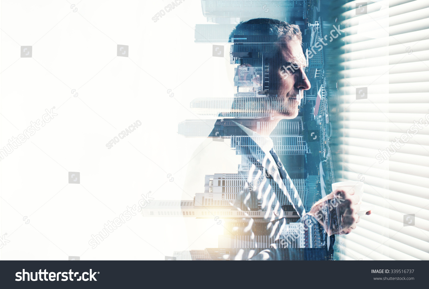 Businessman wearing suit and looking at the window. Double exposure city on sunrise. Horizontal #339516737