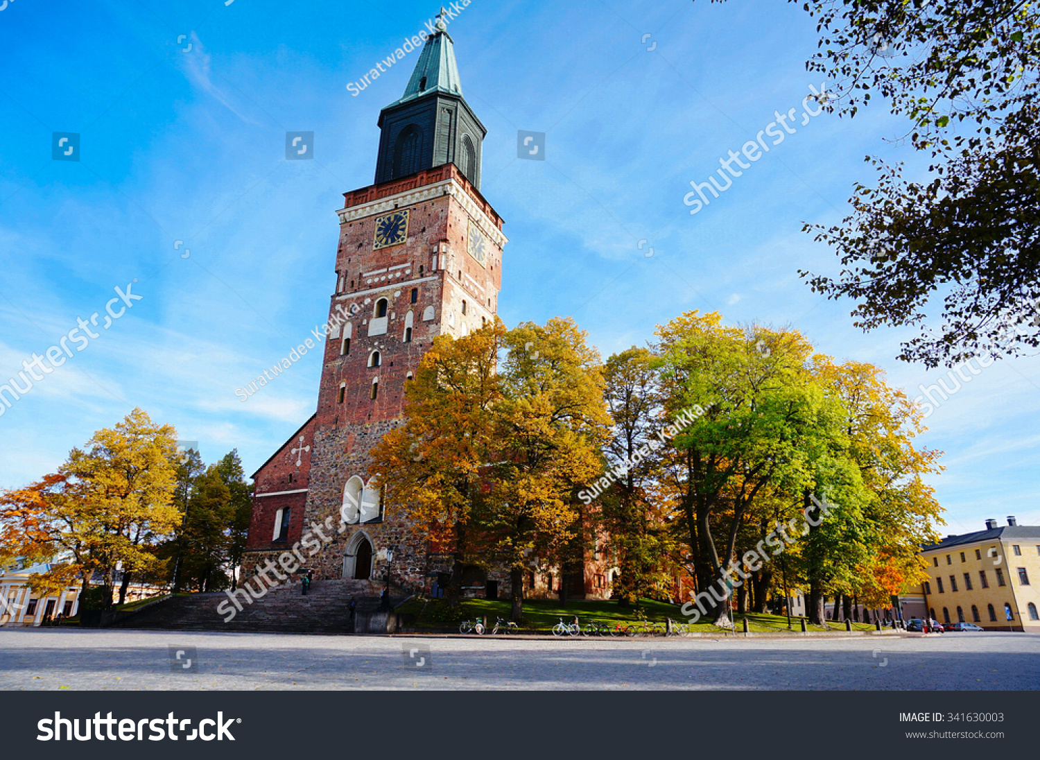 Turku Cathedral, is the Mother Church of the Evangelical Lutheran Church of Finland. It is also regarded as one of the major records of Finnish architectural history. Colorful autumn and blue sky. #341630003