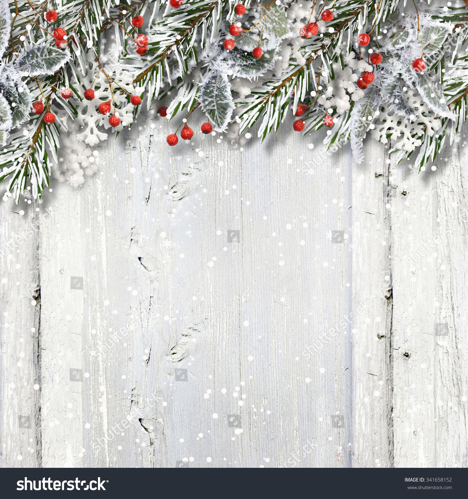 Christmas wooden background with fir branches and holly #341658152