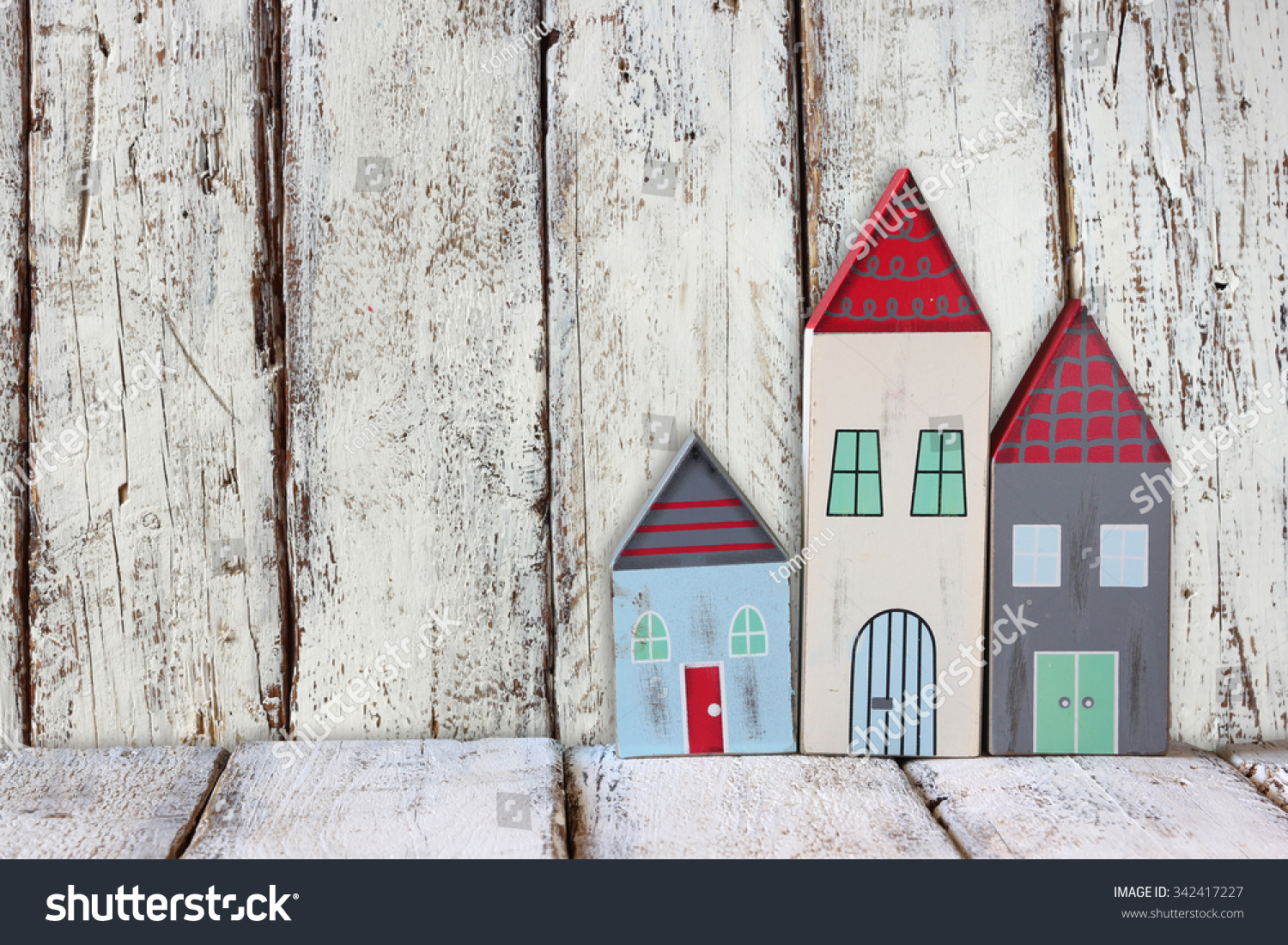image of vintage wooden colorful houses decoration on wooden table.
 #342417227