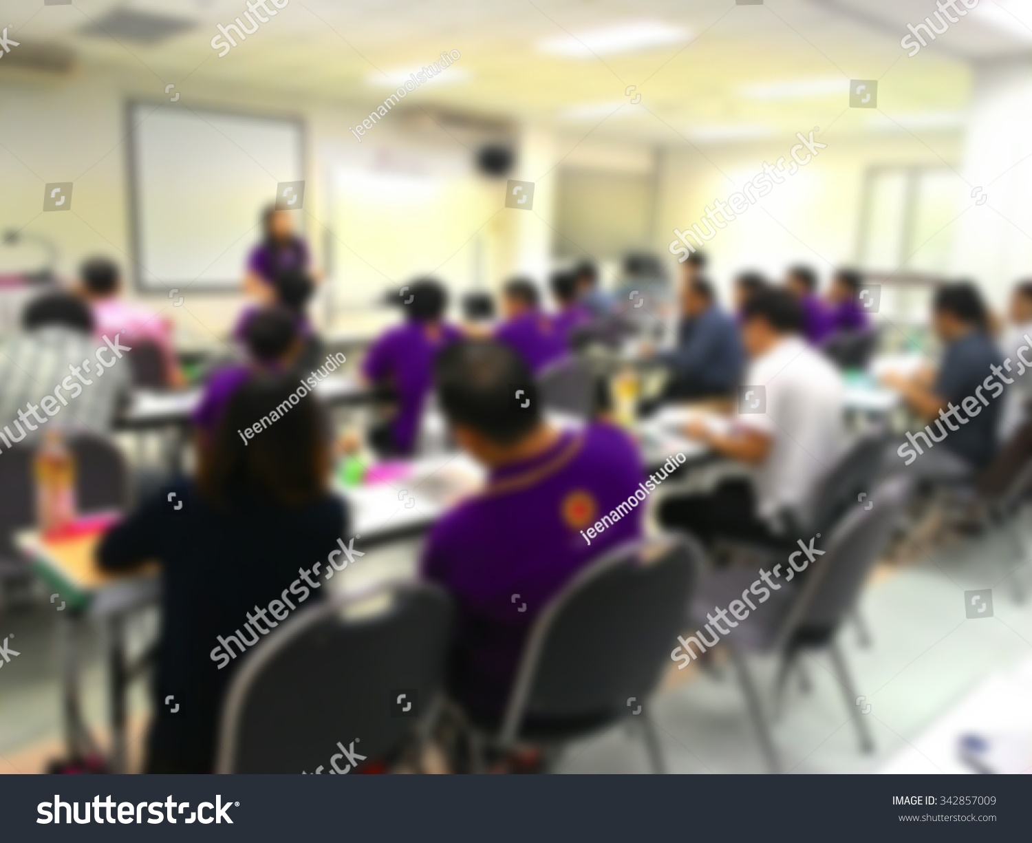 Blur behind student or collegian study lecture in classroom with notebook and screen projector in bachelor or master or Ph.D. degree in university college or business seminar or business meeting
 #342857009