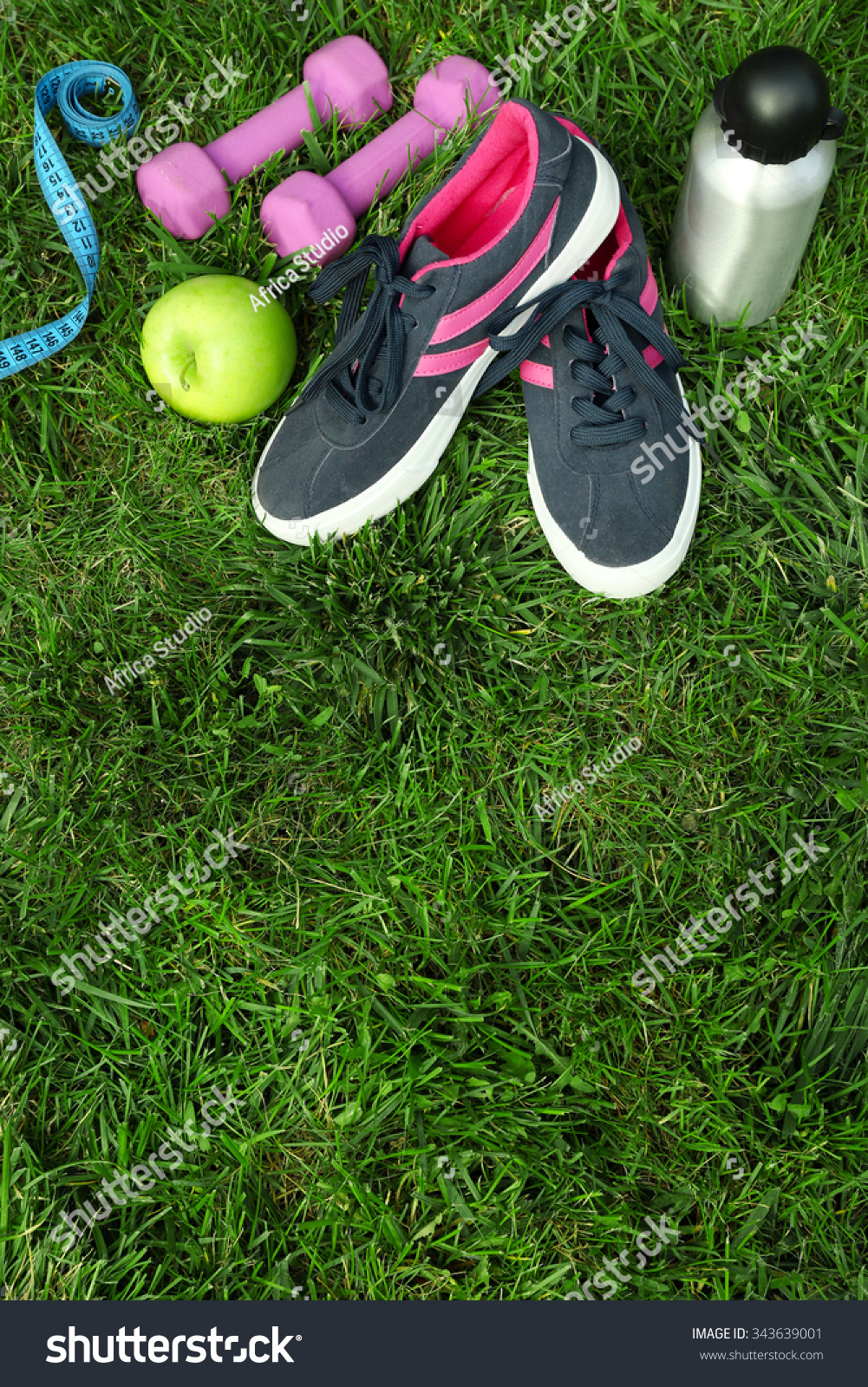 sports equipment on green grass background #343639001