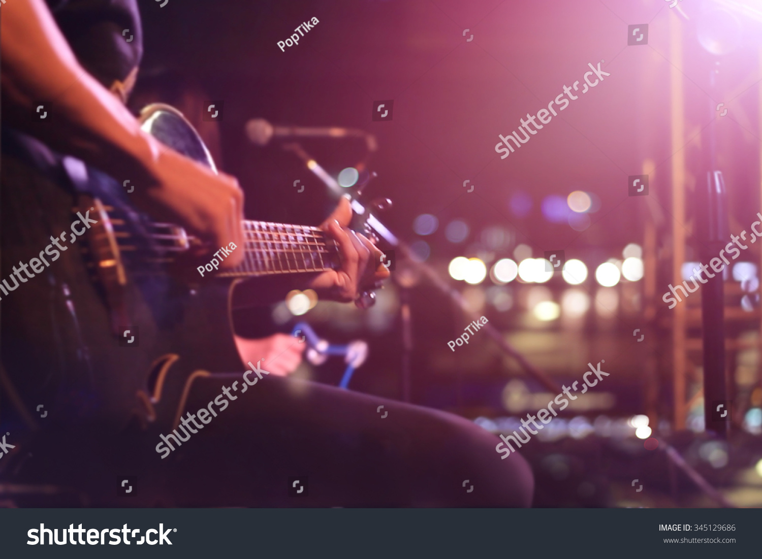 Guitarist on stage for background, soft and blur concept #345129686