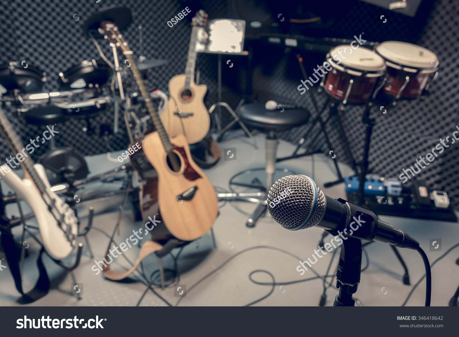 selective focus microphone and blur musical equipment guitar ,bass, drum piano background. #346418642