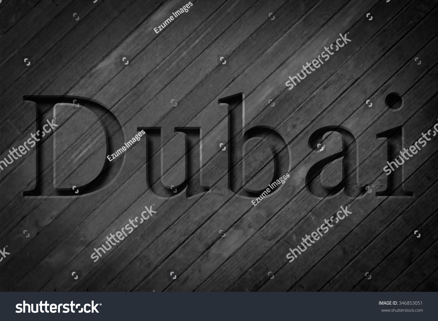 Engraving spelling the city Dubai on textured old surface #346853051
