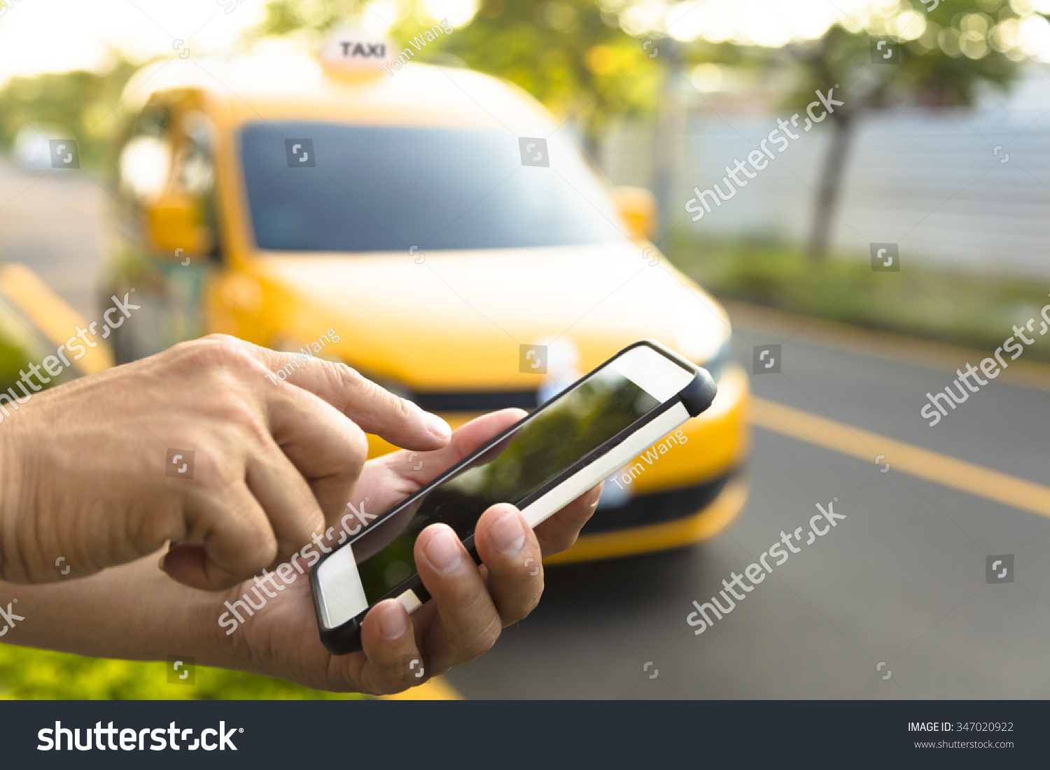 Man orders a taxi from his cell phone #347020922