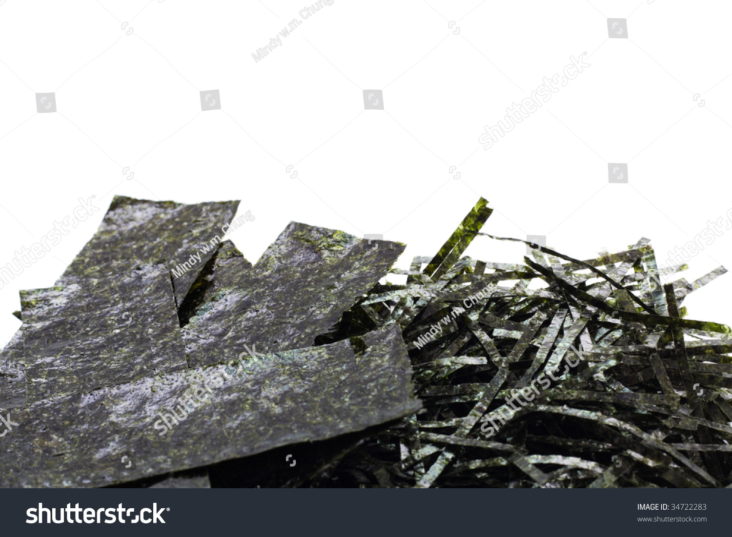 Paper-pieces and shreds of seasoned and dried seaweed, isolated on white with copyspace at the top #34722283