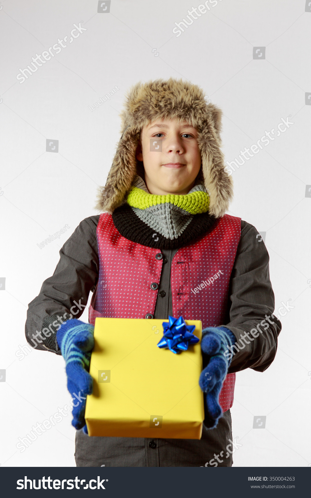 Boy presents a yellow packed present  #350004263