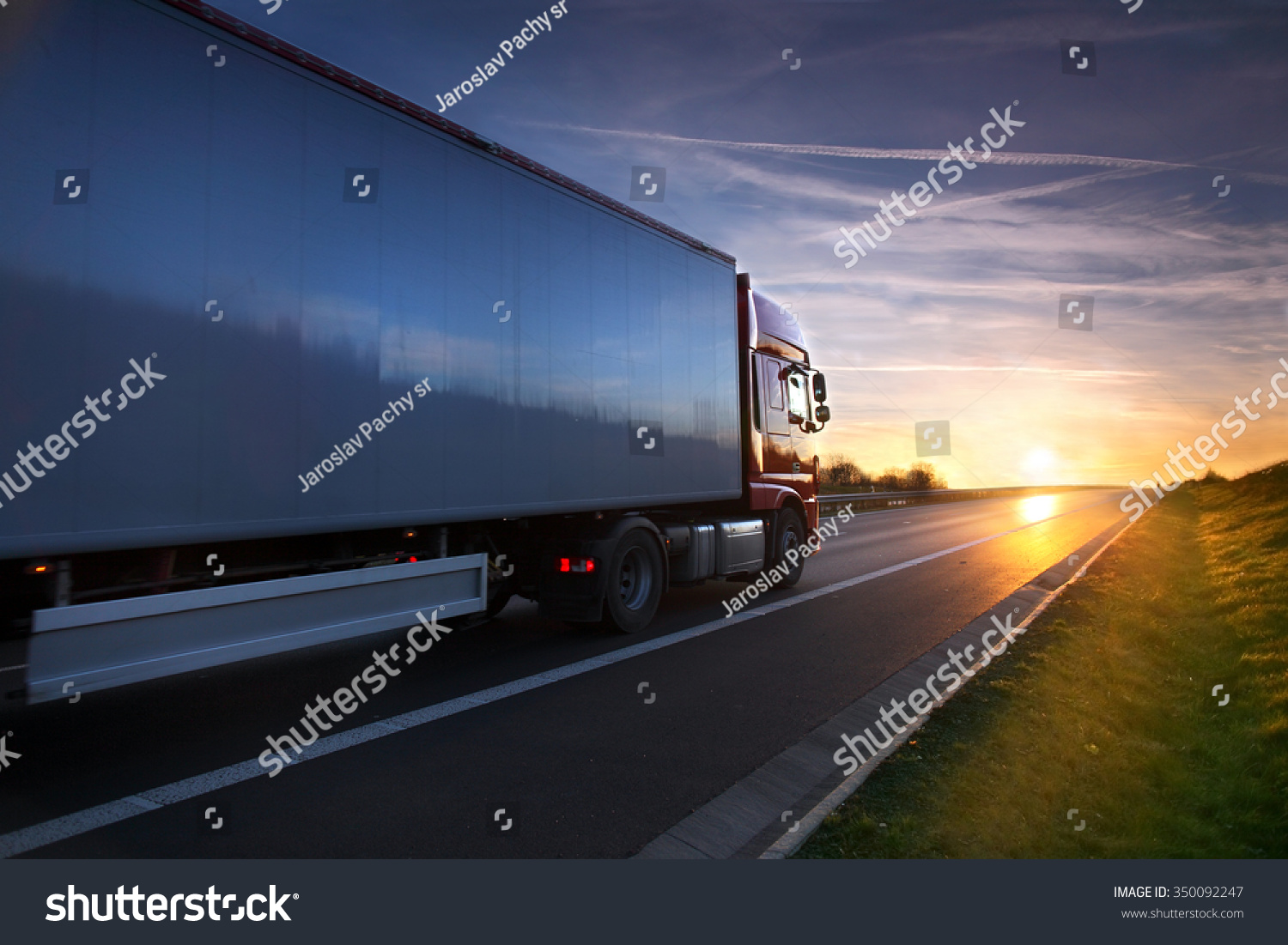 Truck transportation on the road at sunset #350092247