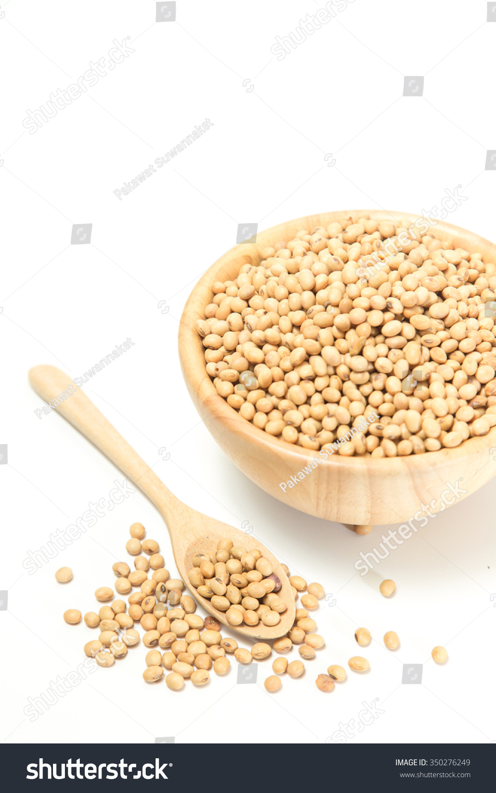 Soya beans in a wooden bowl and a wooden spoon, isolate on white background. #350276249