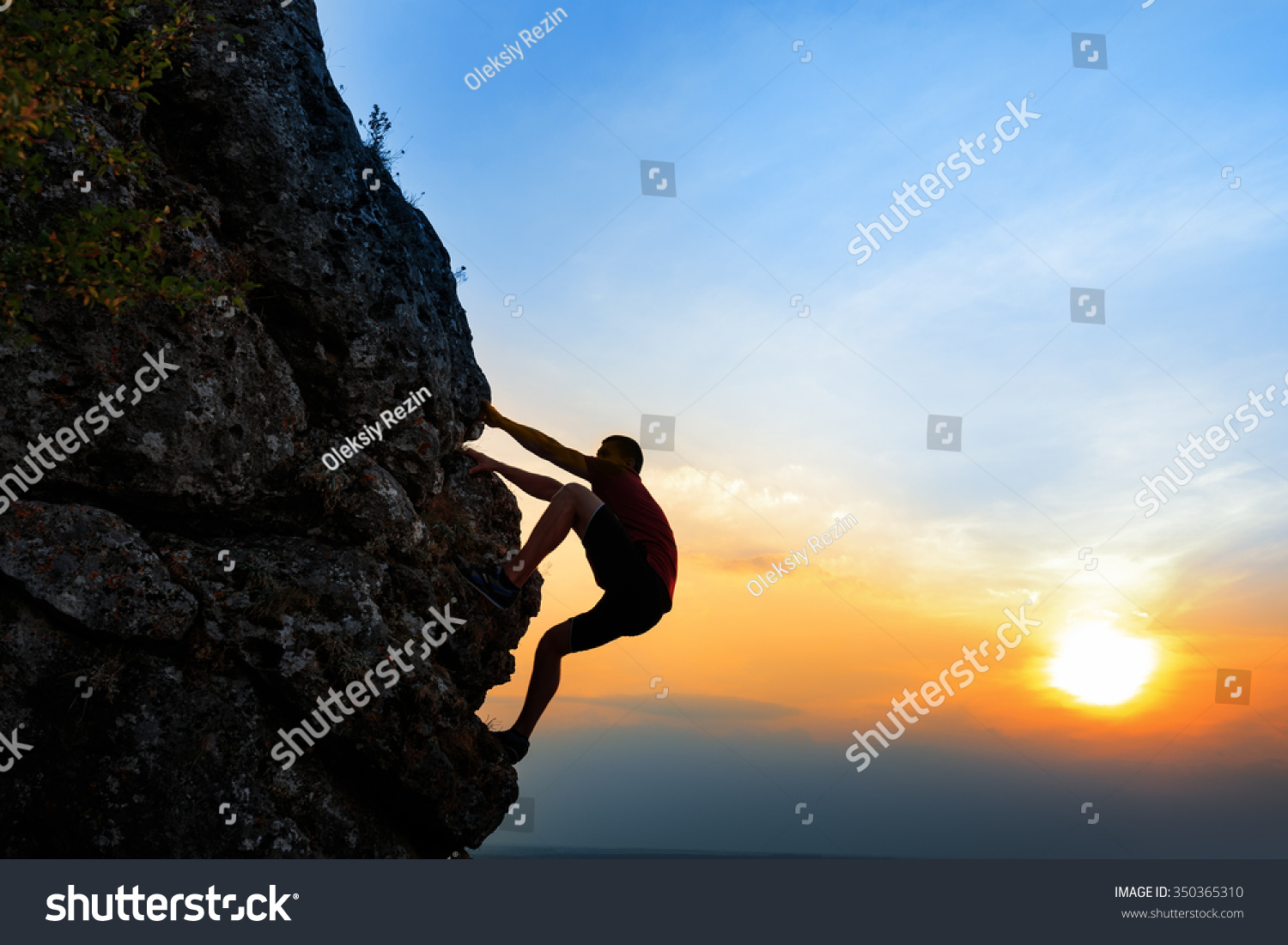 A Silhouette of a Rock climber at sunset background. Sport and active life #350365310