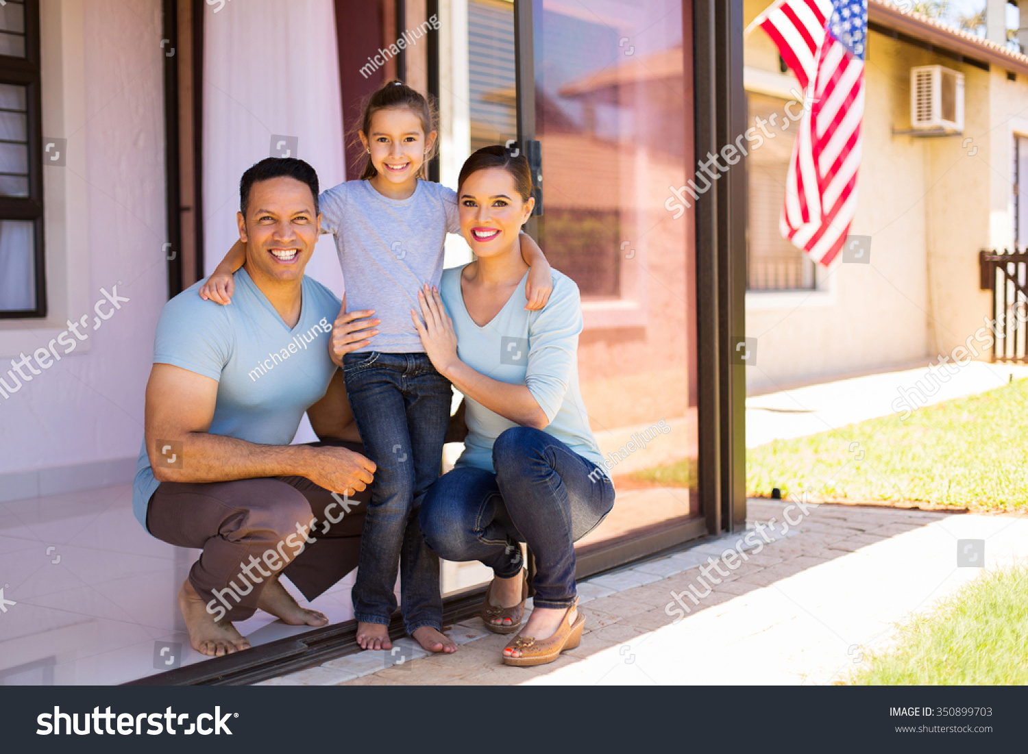 modern american family with USA flag on background #350899703