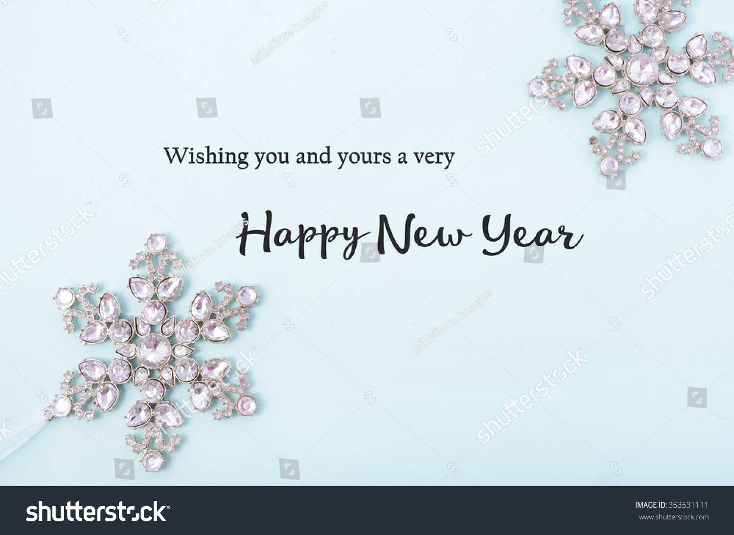 Happy New Year Background with snowflake ornaments on pale blue wood with sample text greeting.  #353531111