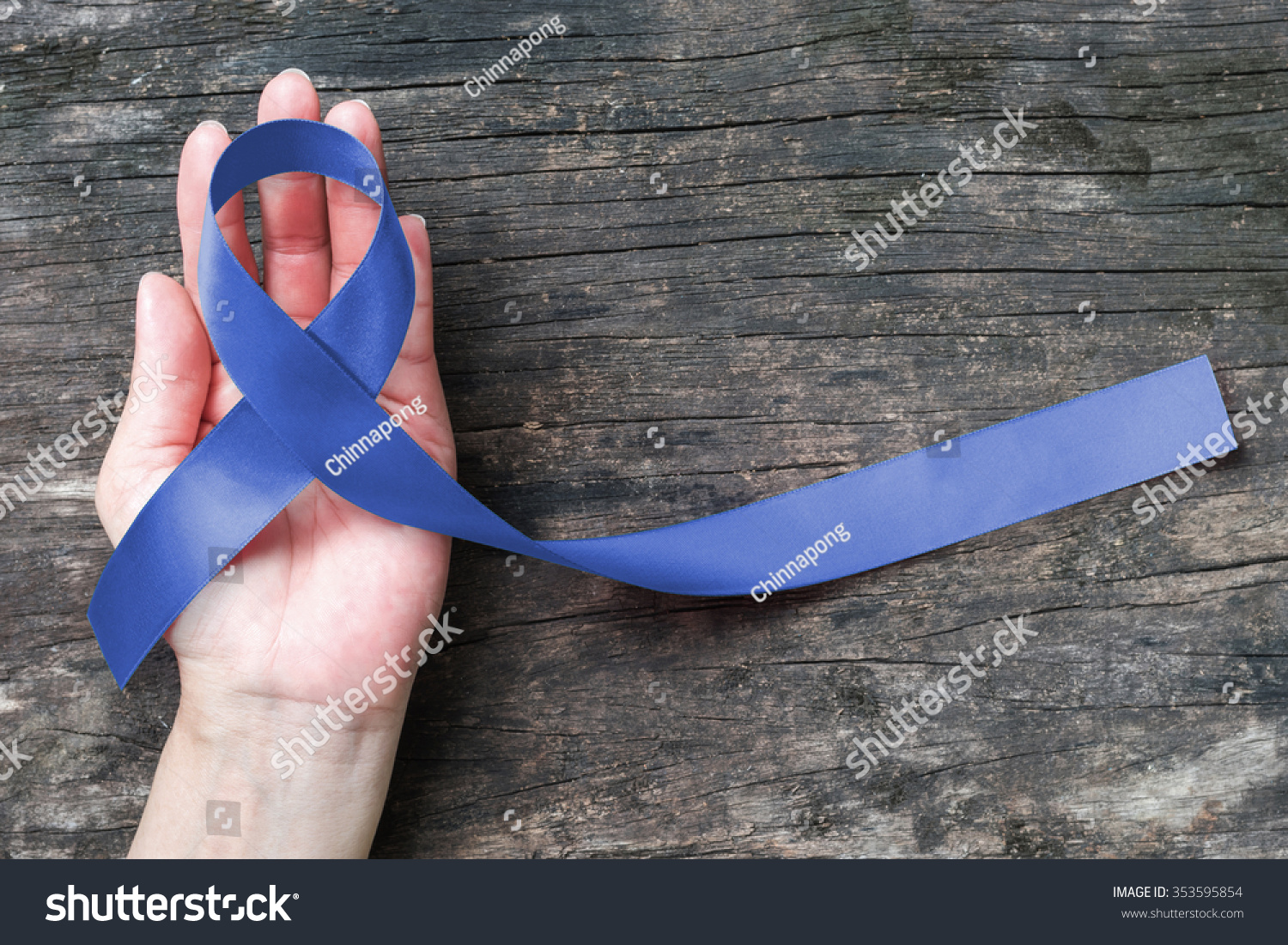 Colorectal Colon cancer, Acute Respiratory Distress Syndrome (ARDS), Juvenile Arthritis and Tuberous Sclerosis, Guillain Barre syndrome awareness with dark blue ribbon on helping hand aged background #353595854