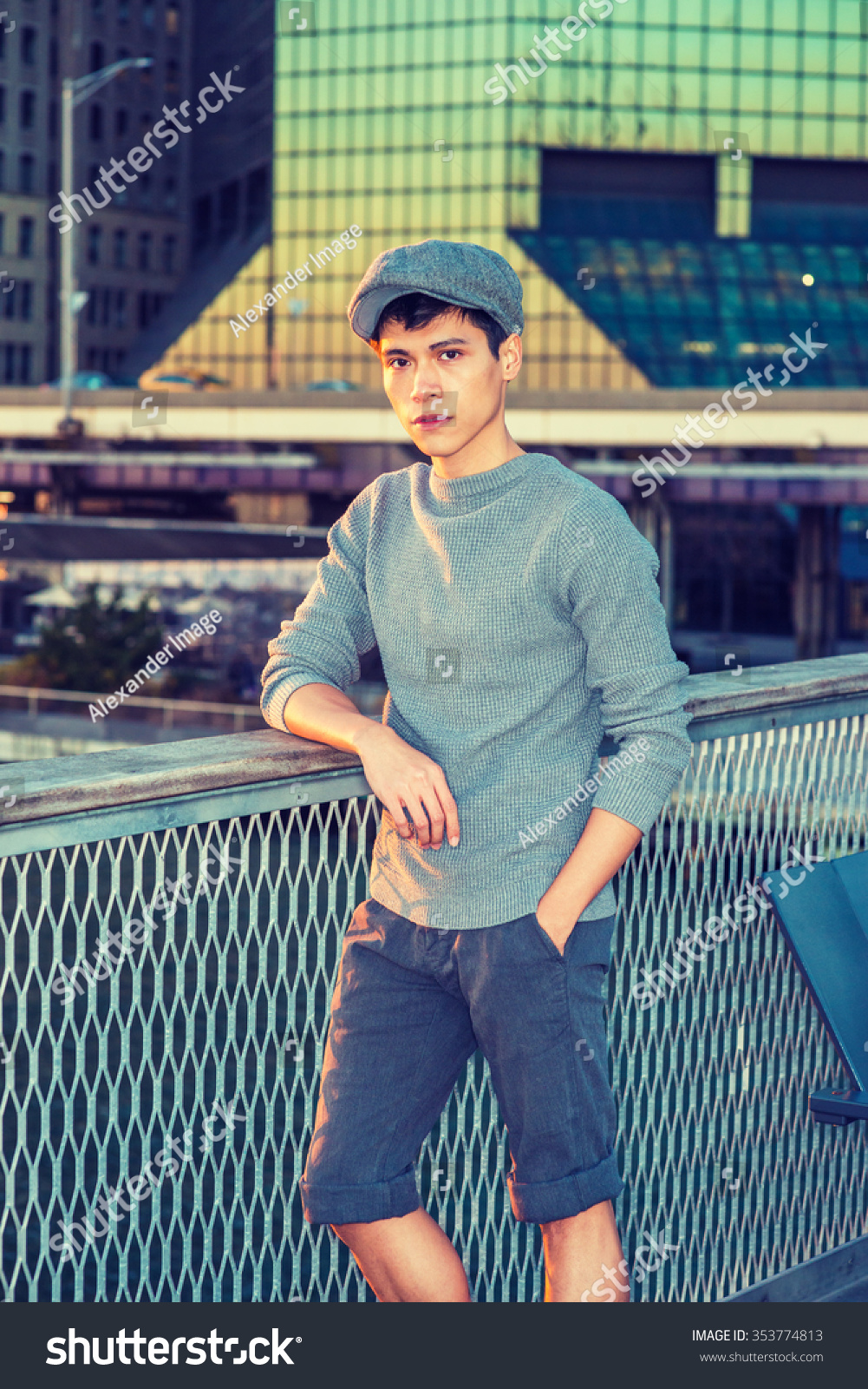 Boy. Wearing newsboy cap, knitting 