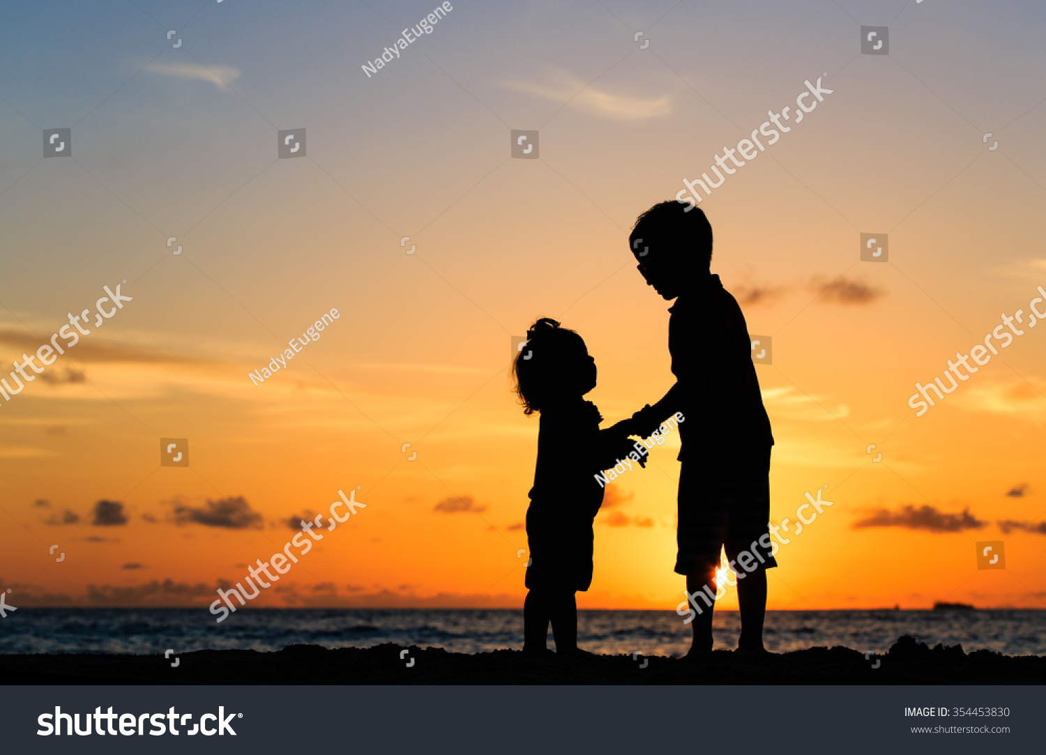 Little Boy And Girl Holding Hands At Sunset Royalty Free Stock Photo Avopix Com