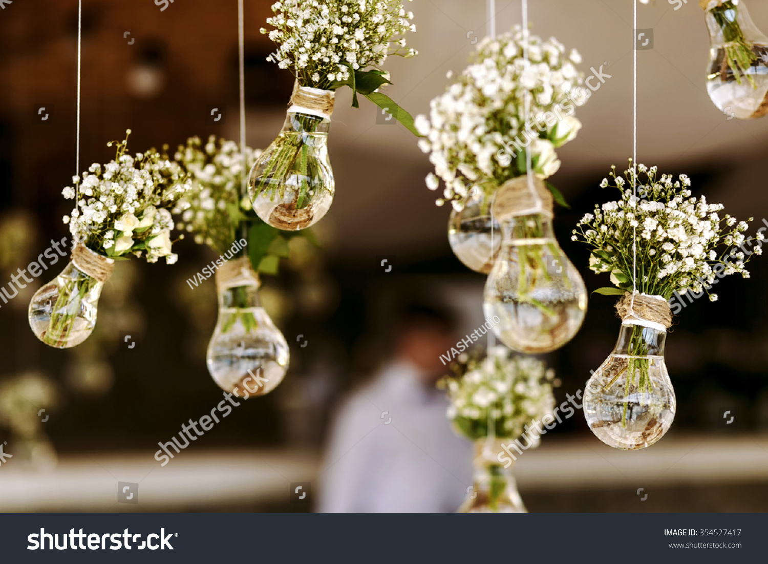 Original wedding floral decoration in the form of mini-vases and bouquets of flowers hanging from the ceiling #354527417