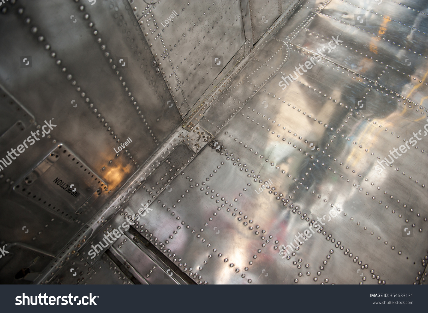 military aircraft close up of outer silver body and rivets #354633131