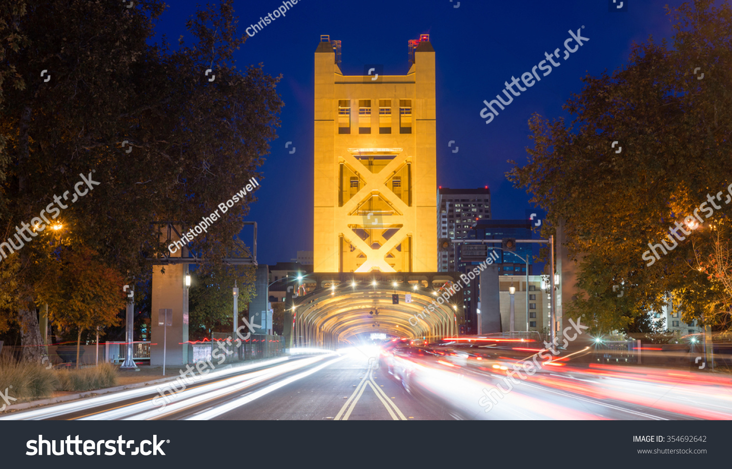 Cars come and go from the Tower Bridge at night in Sacramento #354692642