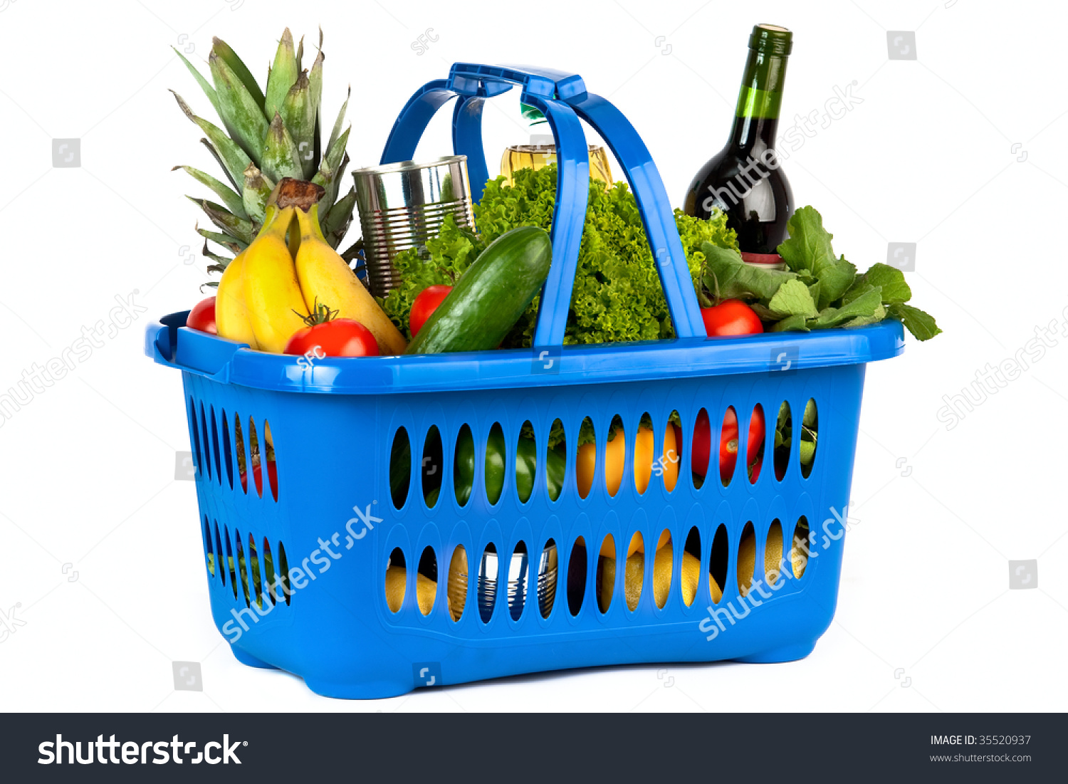 A blue plastic shopping basket on a white background filled with groceries. #35520937