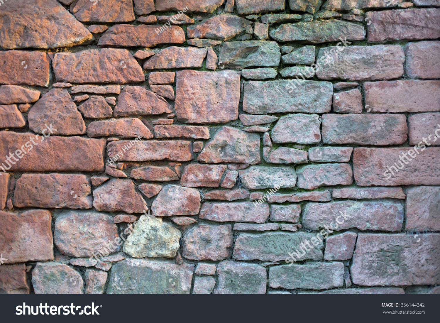 Old stone wall with different size of rock  #356144342