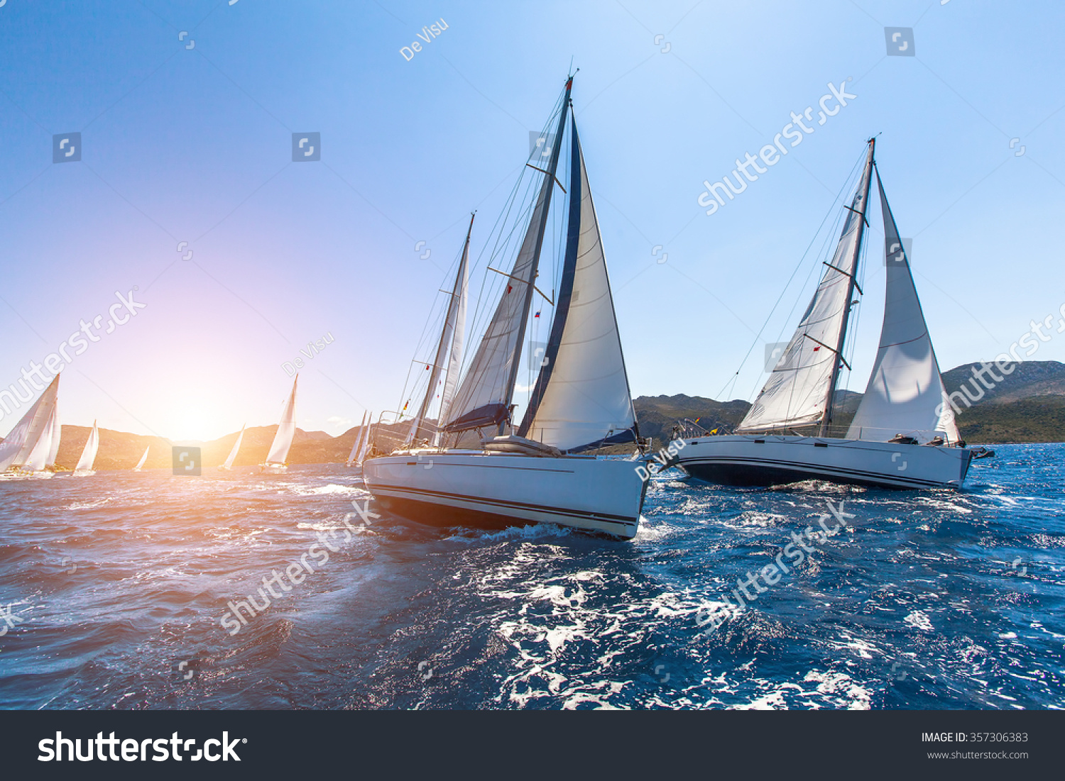 Luxury yachts at Sailing regatta. Sailing in the wind through the waves at the Sea.  #357306383