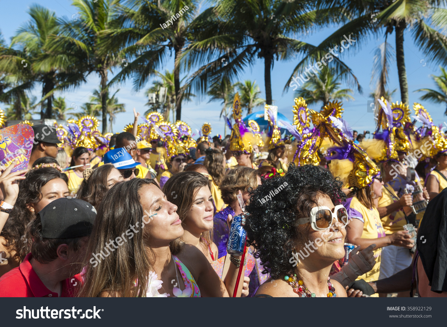 RIO DE JANEIRO, BRAZIL - FEBRUARY 07, 2015: Brazilians celebrate at a carnival street party on a sunny summer afternoon along Ipanema Beach. #358922129